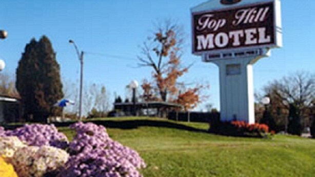 Naamplaatje voor Motel Top Hill.