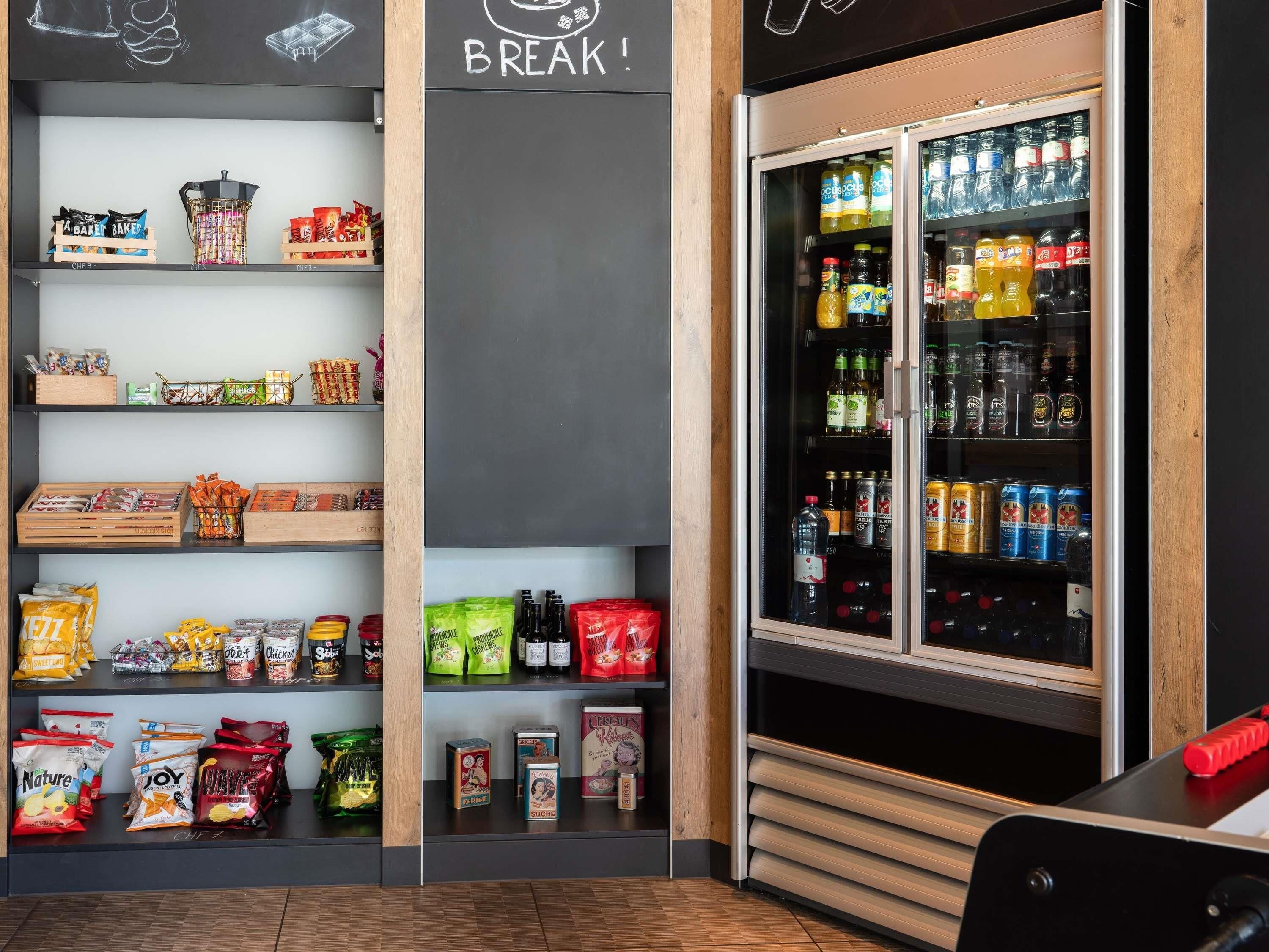 A snack and beverage display area with various packaged snacks and drinks.