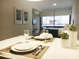 Deluxe Studio | Living area | 32-inch flat-screen TV with digital channels, LED TV, Netflix