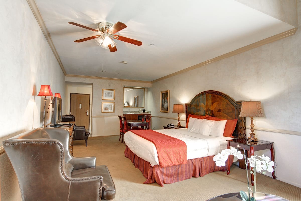 desk, laptop workspace, blackout curtains, iron/ironing board