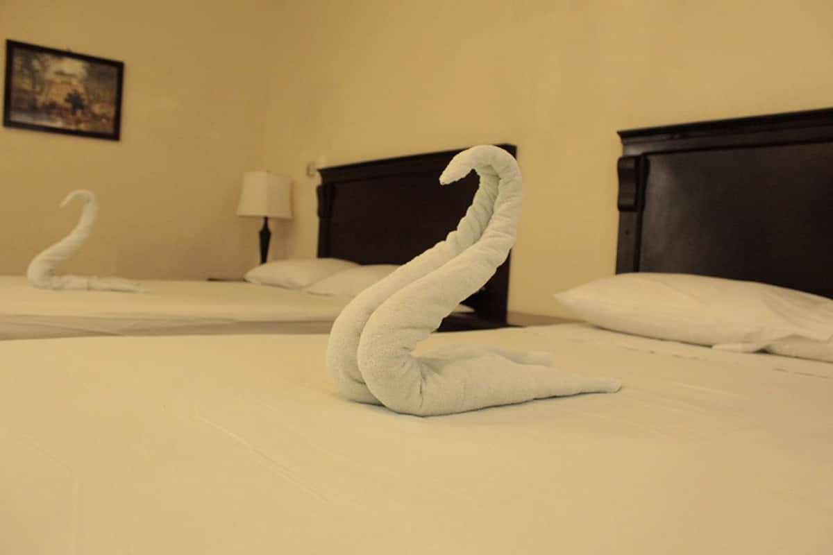 deluxe double room, 2 double beds | 1 bedroom, individually decorated, iron/ironing board, rollaway beds