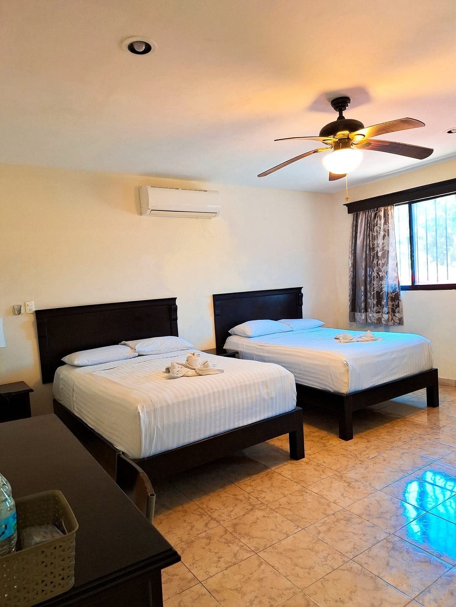 deluxe double room, 2 double beds | 1 bedroom, individually decorated, iron/ironing board, rollaway beds