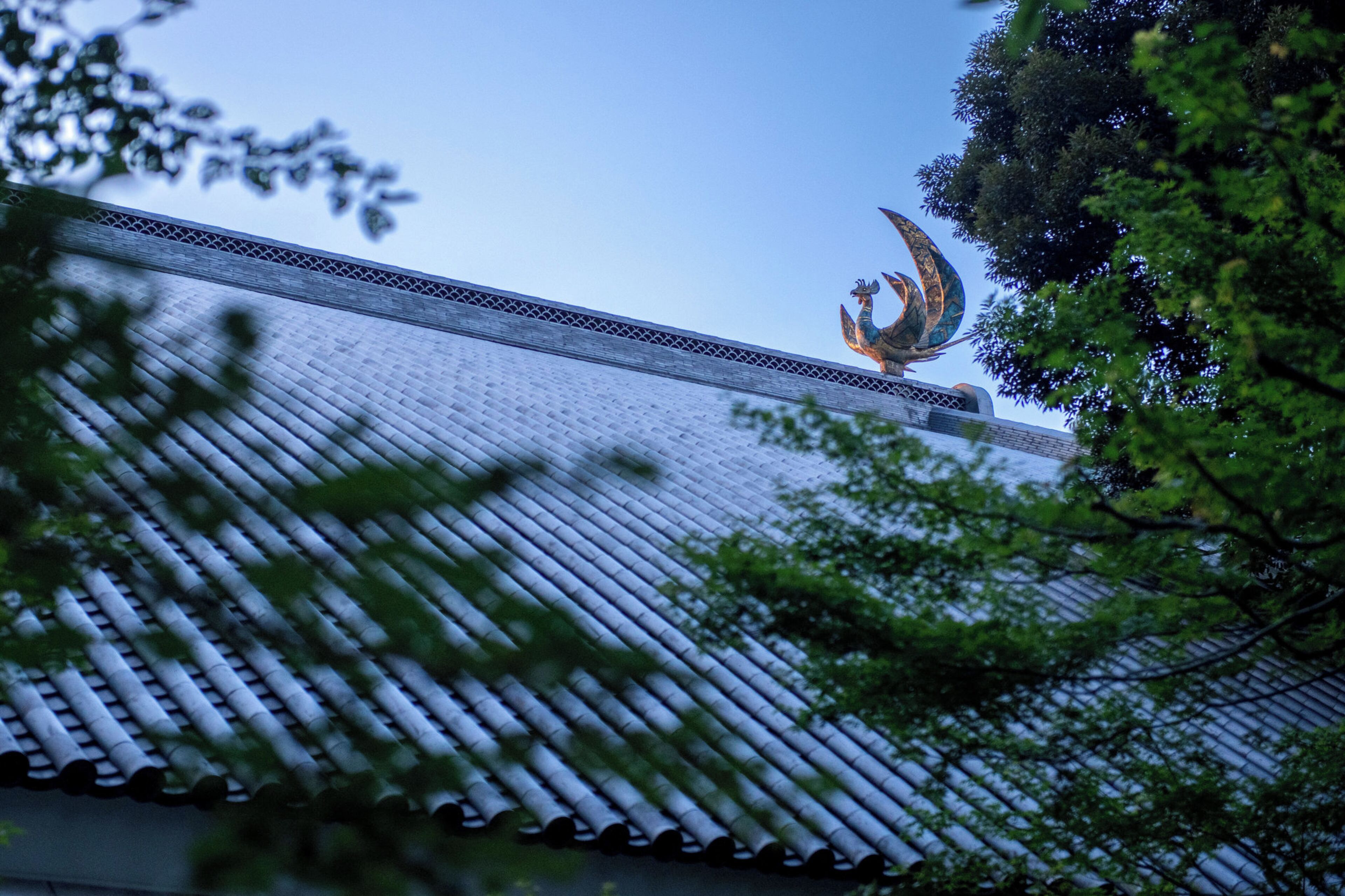 A traditional roof with a decorative finial.