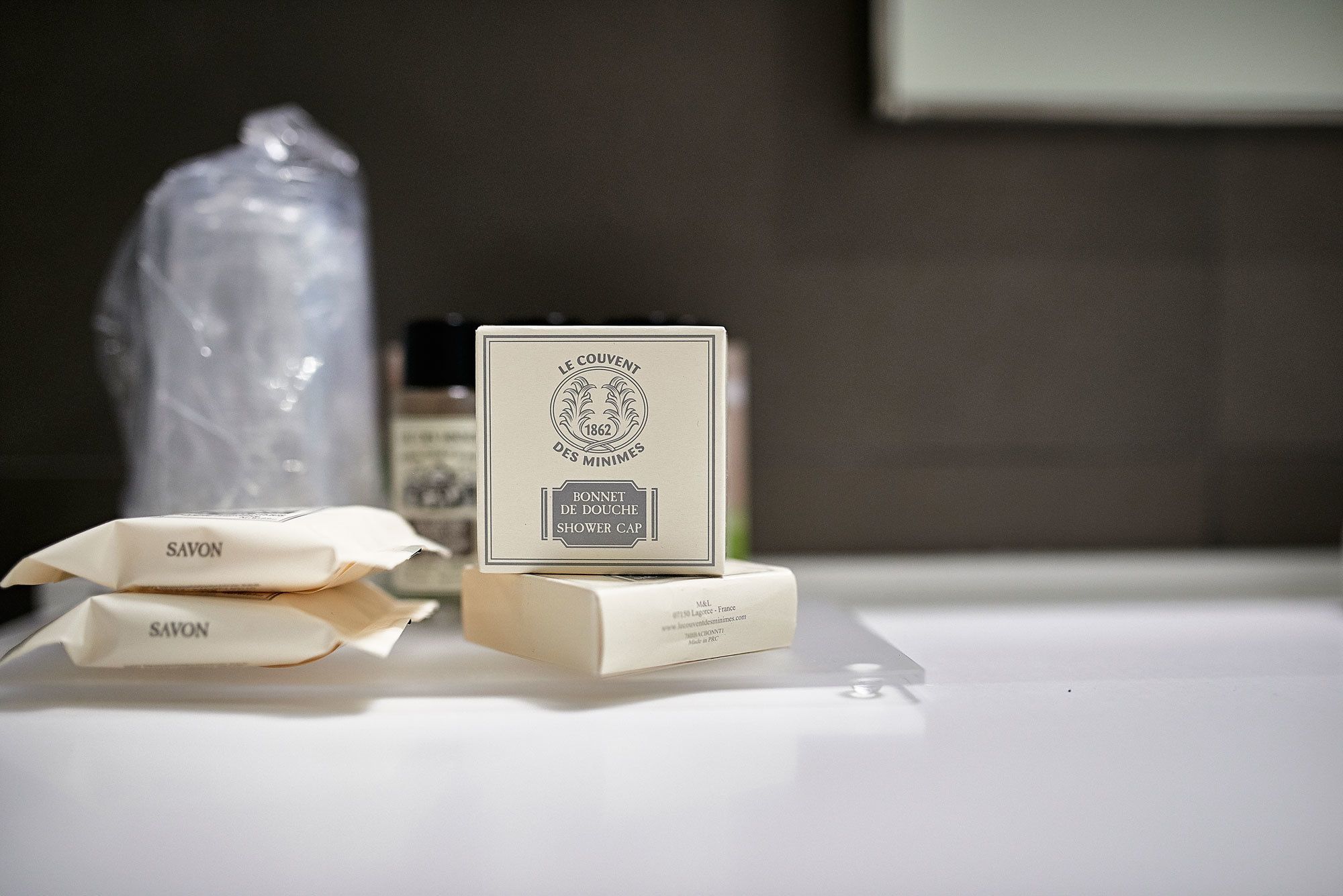 designer toiletries, hair dryer, slippers, bidet