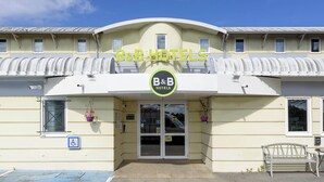 A hotel with a sign reading "B&B HOTELS" above the entrance.