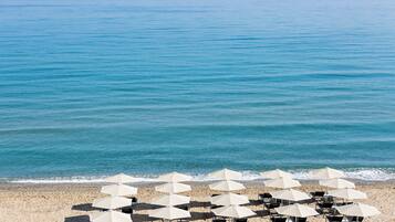 On the beach, sun loungers, beach umbrellas, beach towels