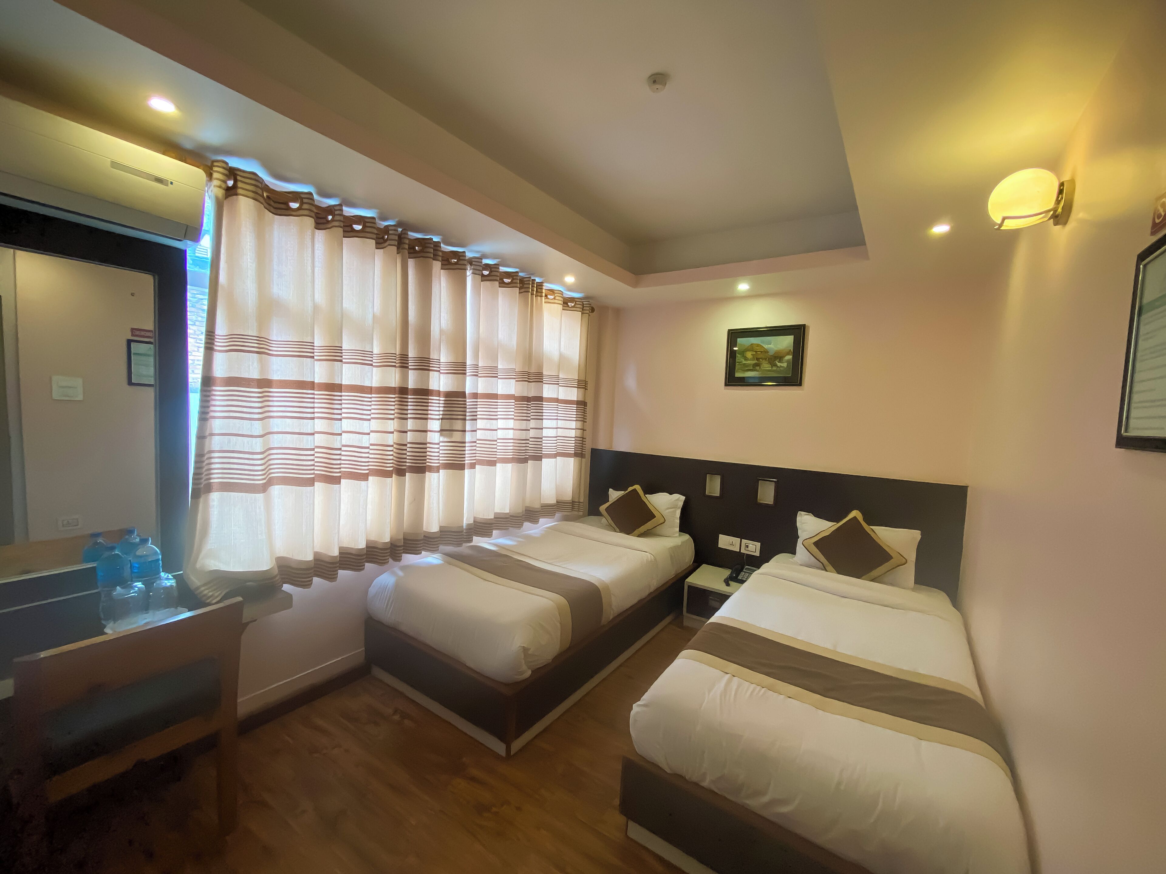 deluxe twin room, 2 single beds | in-room safe, desk, laptop workspace, free wifi