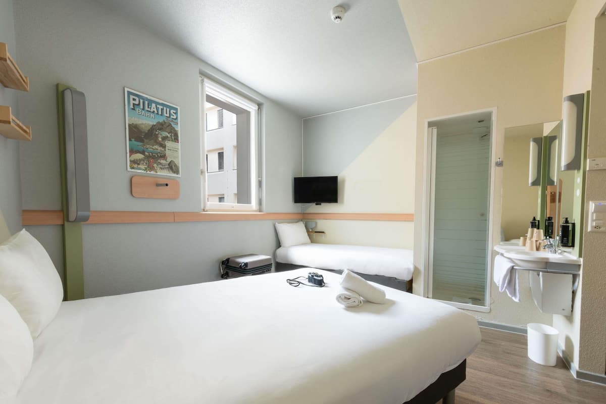 Family Twin Room, Multiple Beds | In-room safe, desk, laptop workspace, soundproofing