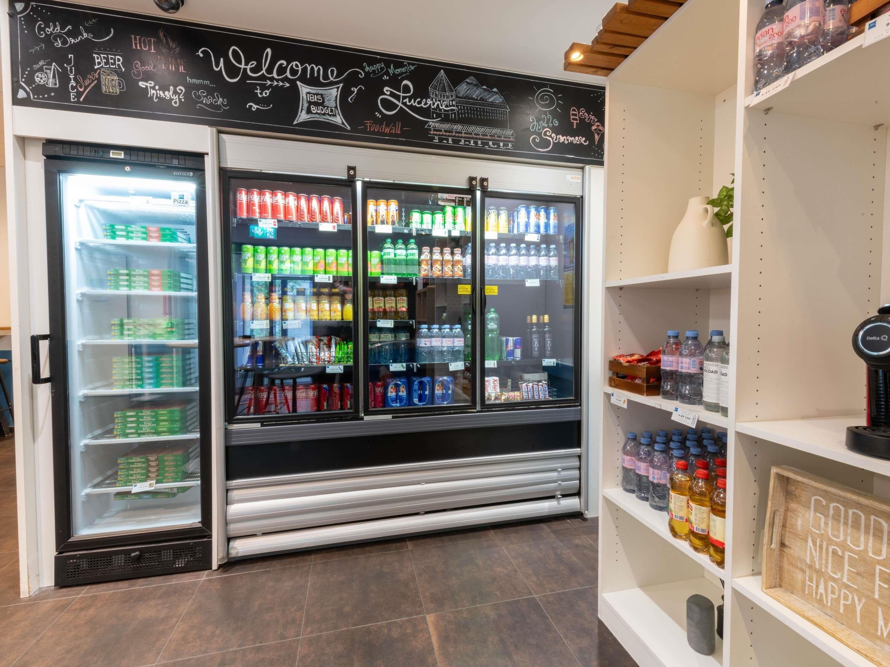 A beverage vending machine with a variety of drinks and snacks.