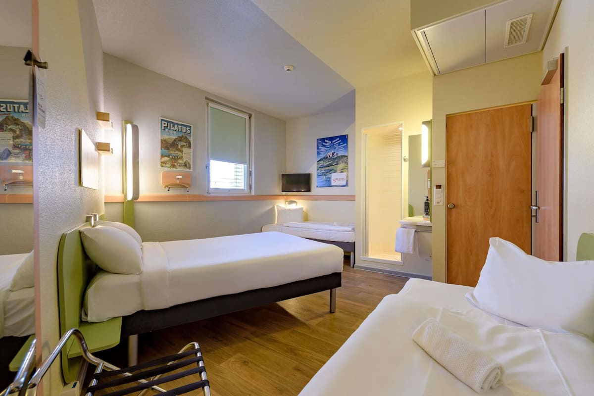 Family Twin Room, Multiple Beds | In-room safe, desk, laptop workspace, soundproofing