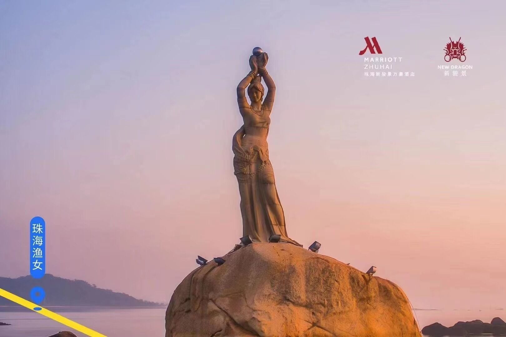 A statue of a woman standing on a rock with a sunset in the background.