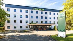 A B&B hotel with a modern facade, multiple windows, and a paved entrance area. -  B&B HOTEL Essen-Nord (Essen)