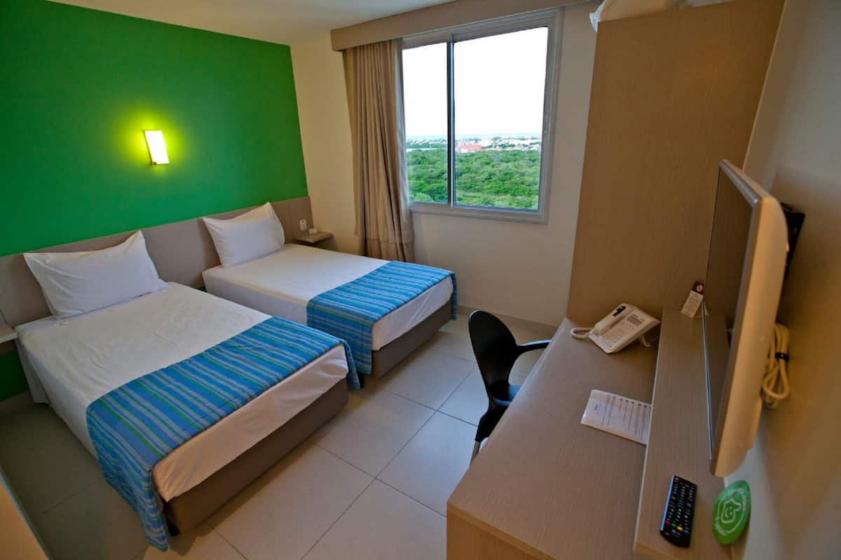 Standard Twin Room, 2 Single Beds | Minibar, in-room safe, individually decorated, desk