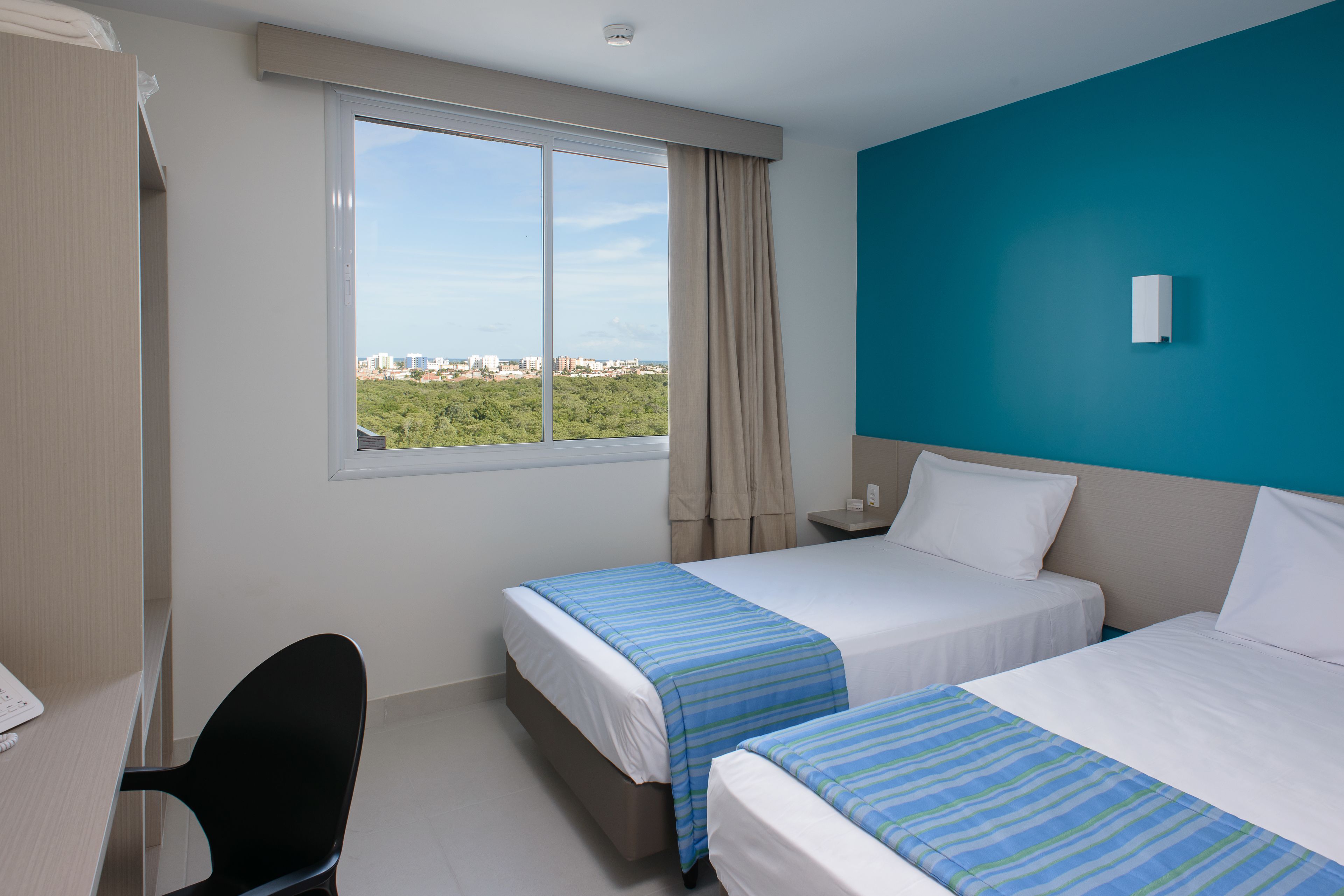 standard twin room, 2 single beds | minibar, in-room safe, individually decorated, desk