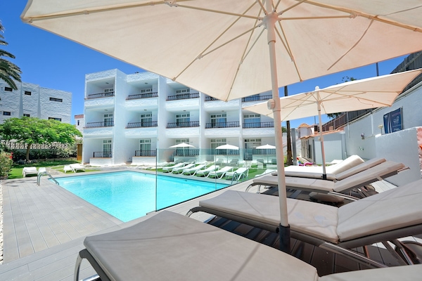 Outdoor pool, pool umbrellas, pool loungers