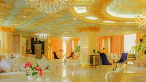 A luxurious hotel lobby with ornate chandeliers, plush seating, and a grand staircase. - Lace Boutique Hotel (Johor Bahru)
