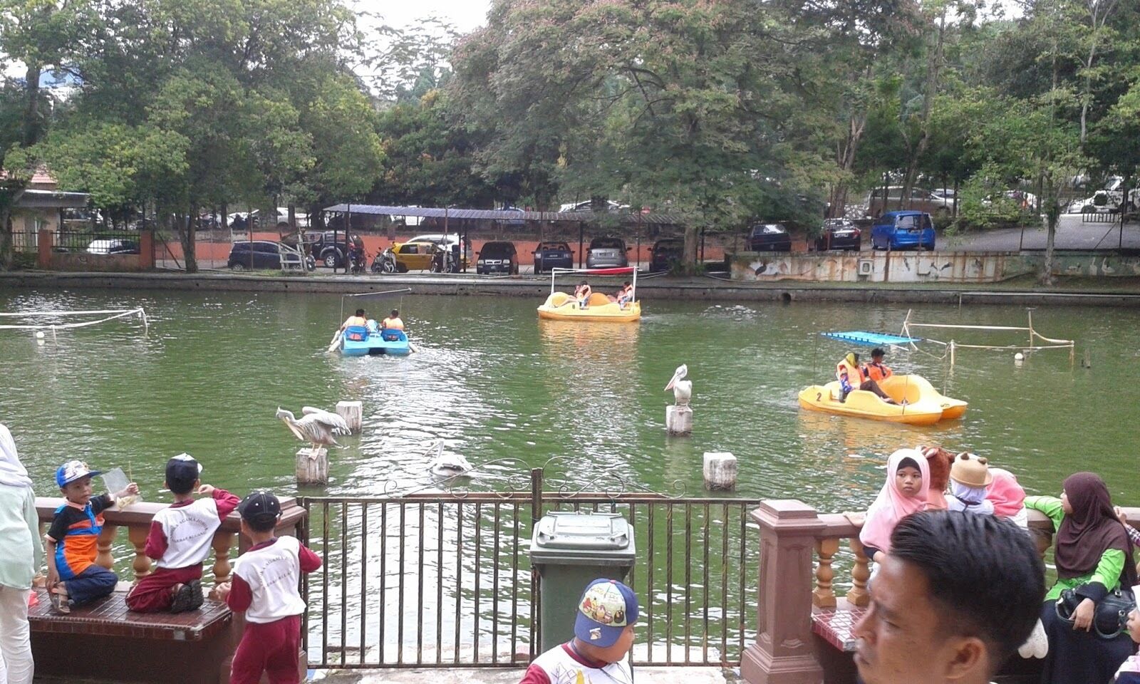 A riverside area with boats and people.