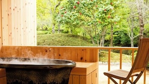 A wooden spa tub with steam, a wooden deck, and a chair. - Sennomori (Ise)