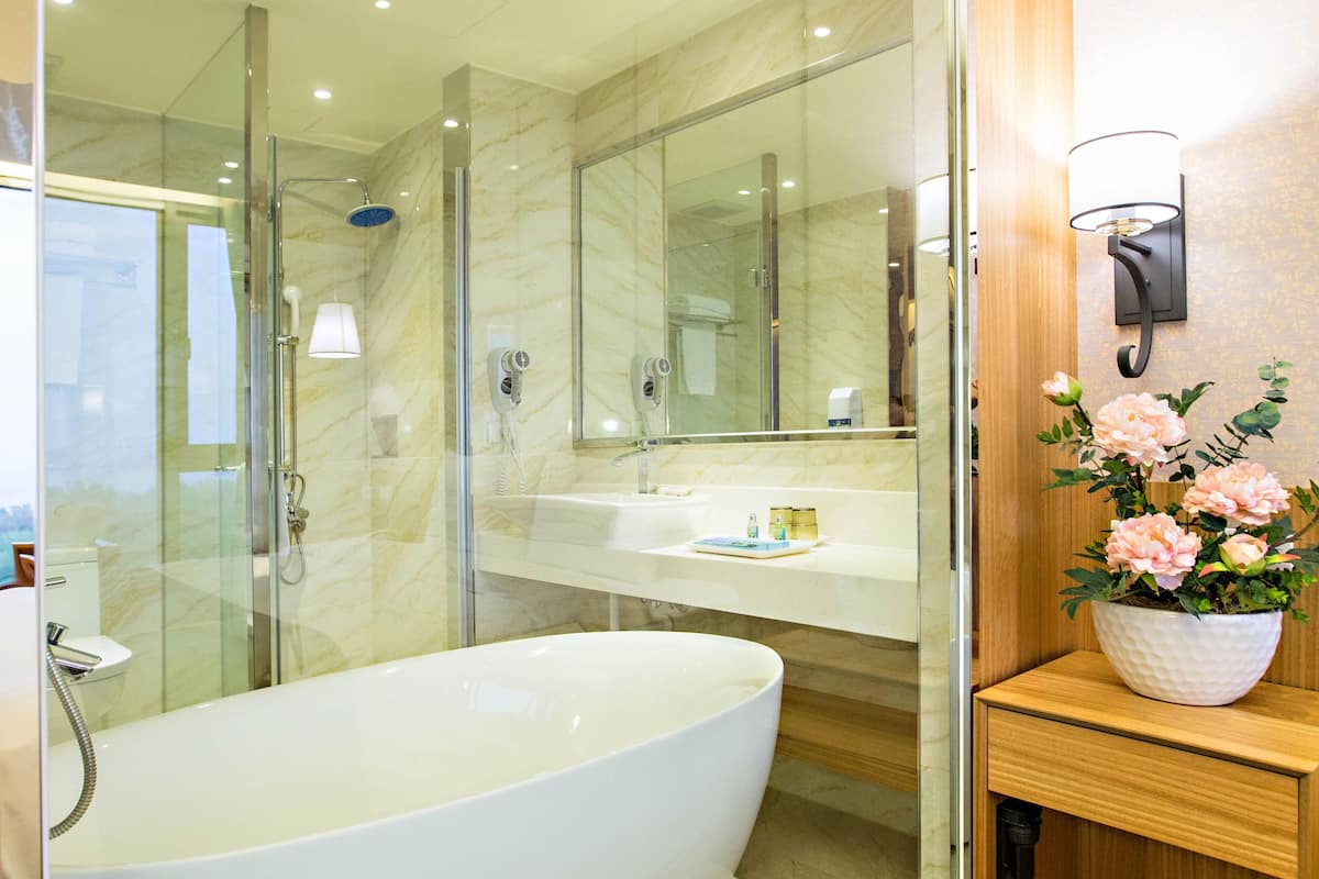 double bed with sea view | bathroom | hair dryer, slippers, towels