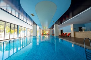 Indoor pool, seasonal outdoor pool, pool umbrellas, sun loungers