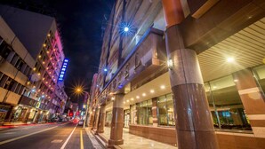 A hotel with a modern facade, large glass windows, and a well-lit entrance. - KKS Hotel (Hualien City)
