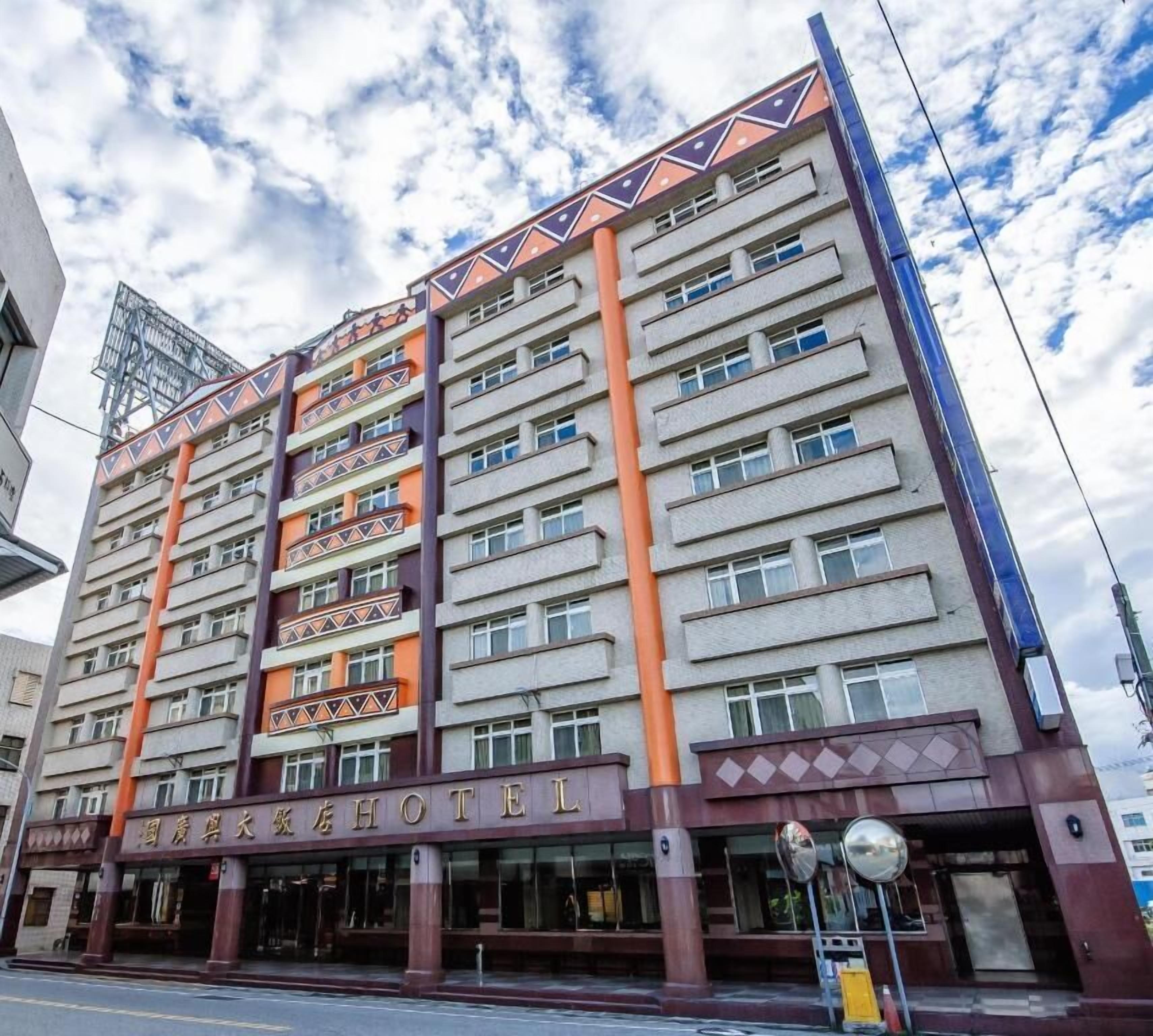 A multi-story hotel with a distinctive facade featuring geometric patterns and a prominent entrance.