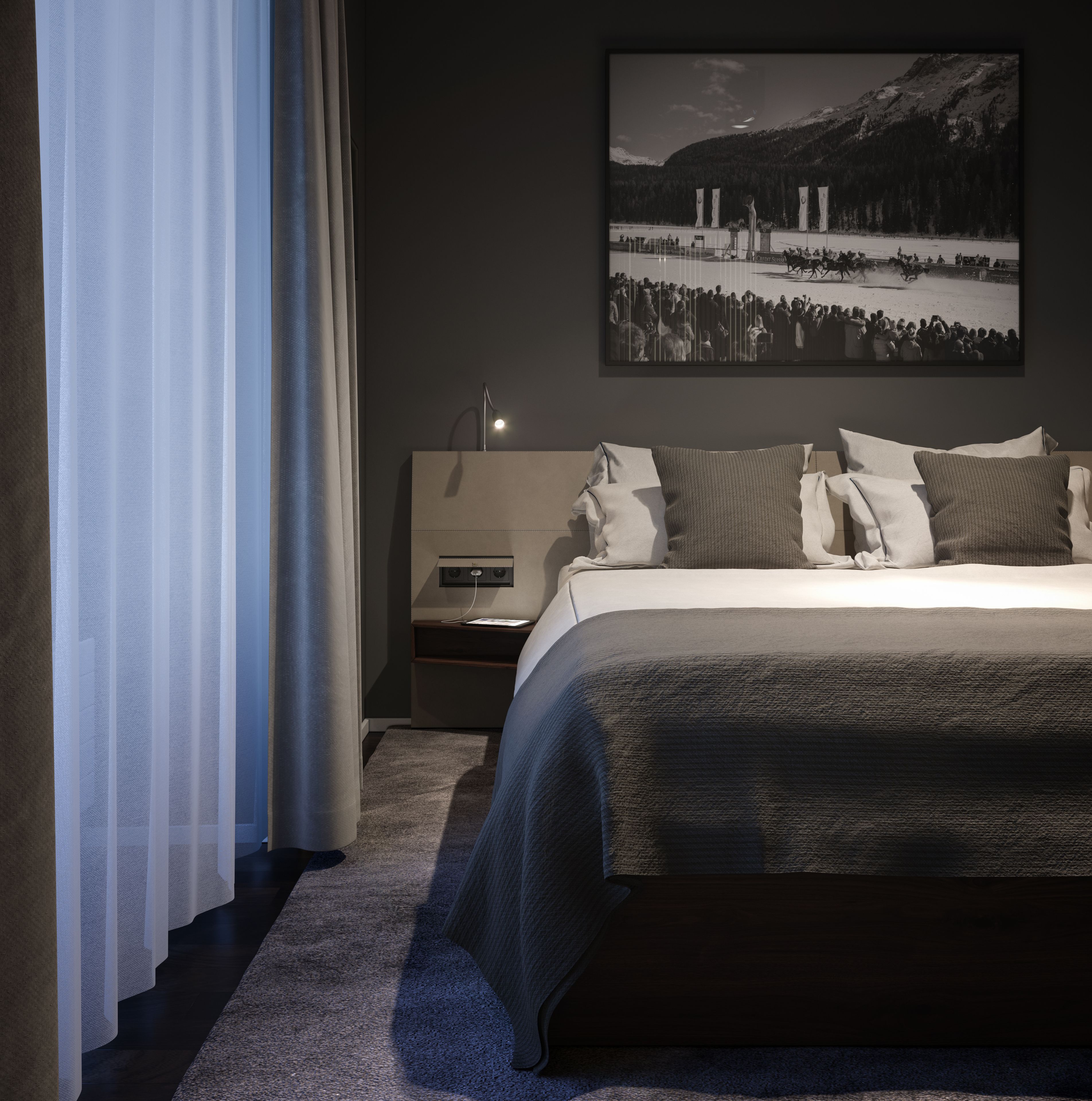 Une chambre à coucher avec un lit, une table de chevet, une lampe et un tableau représentant un paysage montagneux.