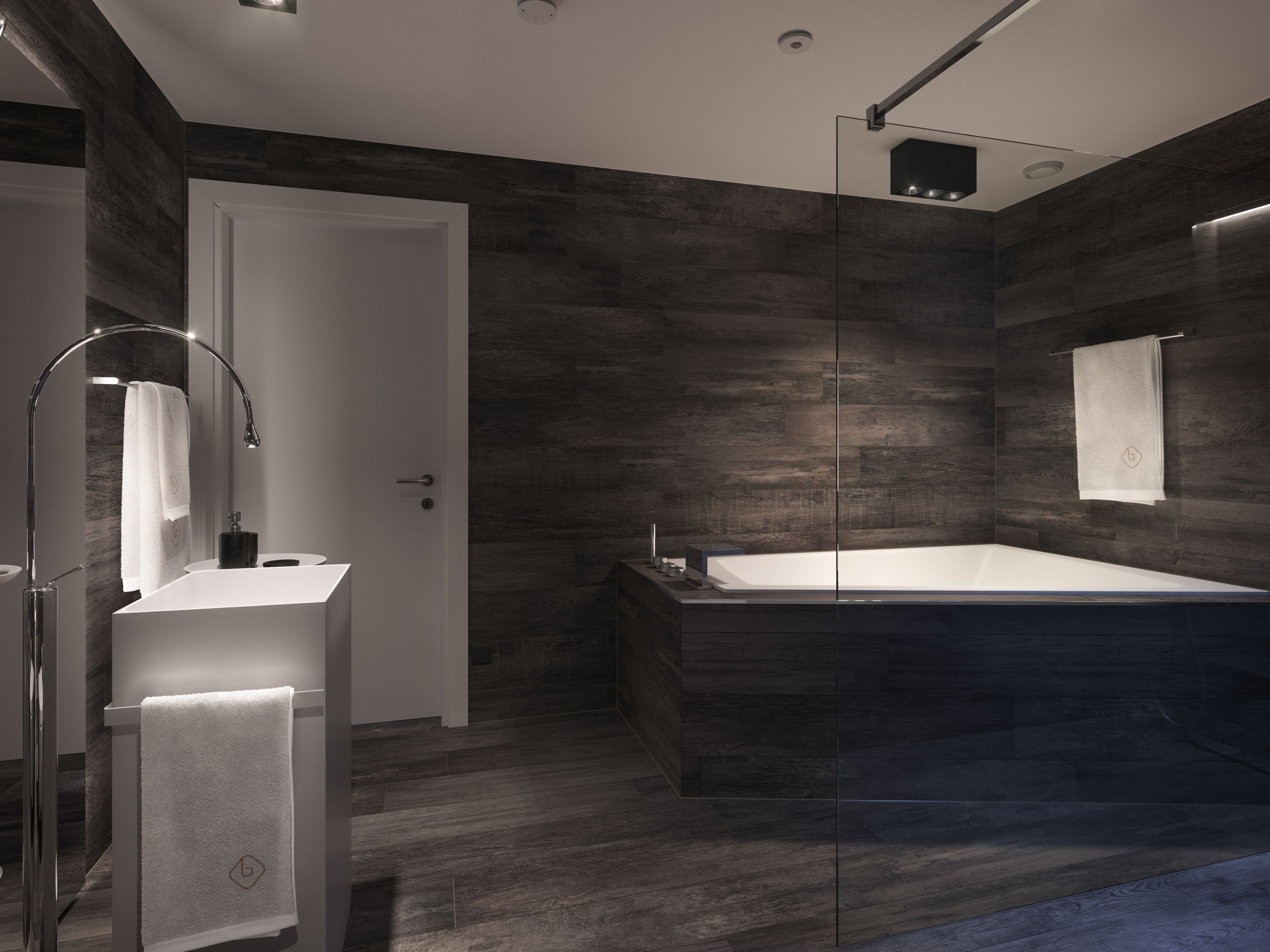 A modern bathroom with a freestanding bathtub, a glass shower enclosure, and a vanity with a mirror.