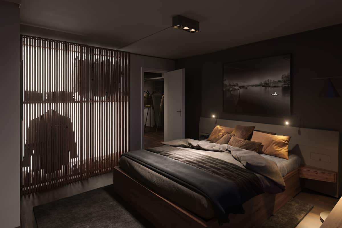 A modern bedroom with a bed, bedside tables, a wardrobe, and a large framed picture on the wall.