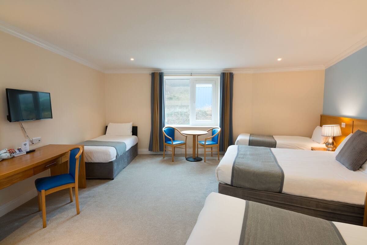 family room | in-room safe, desk, laptop workspace, blackout curtains