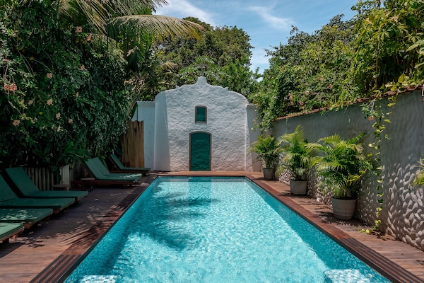 Outdoor pool, a waterfall pool, sun loungers