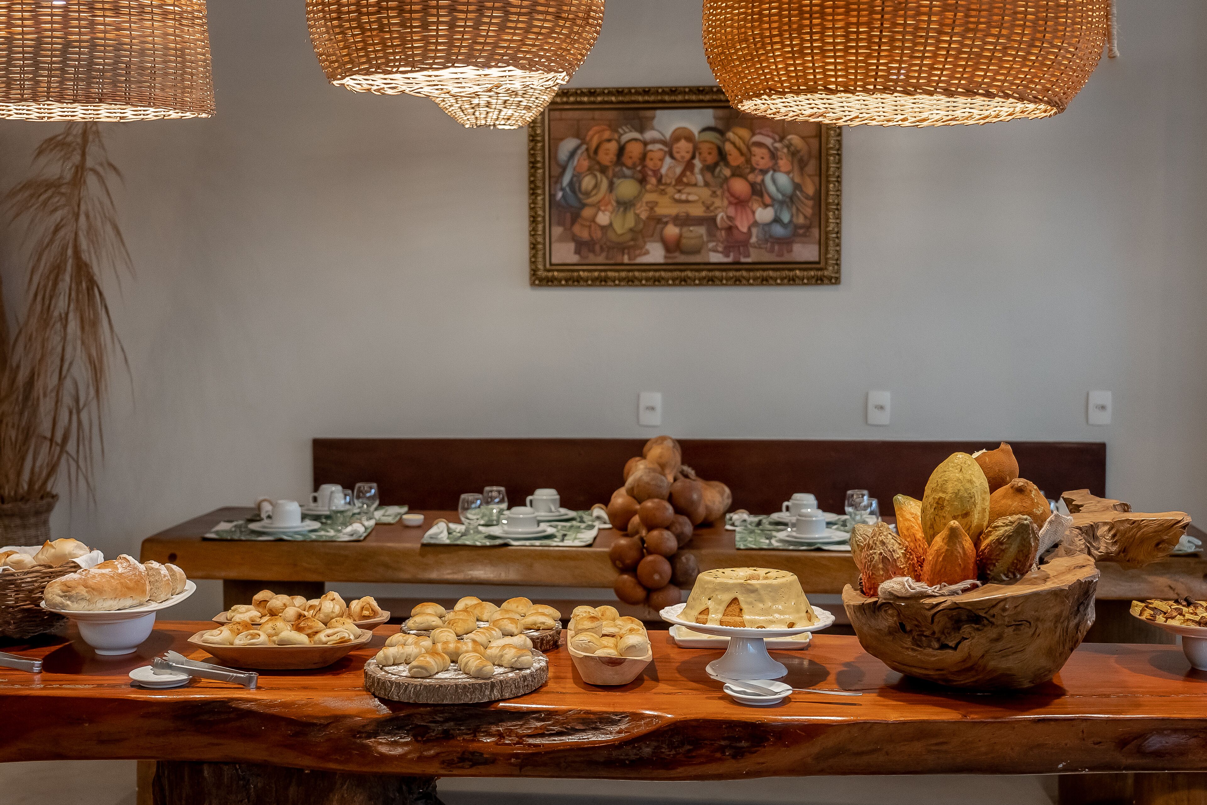 A buffet table with various baked goods and a decorative centerpiece.