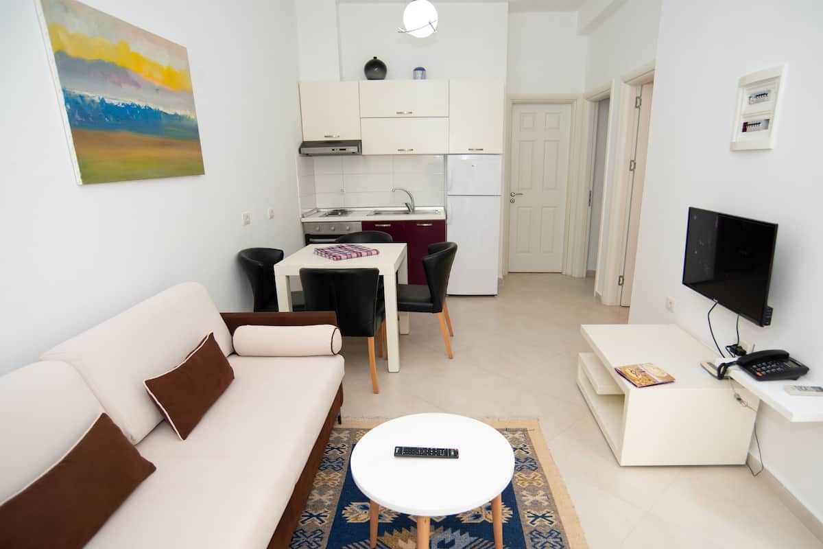 Apartment, 2 Bedrooms, Patio (4 Adults) | Living room | Flat-screen TV