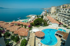 Indoor pool, seasonal outdoor pool, pool umbrellas, pool loungers