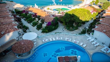 Seasonal outdoor pool, open 9:00 AM to 7:00 PM, pool umbrellas