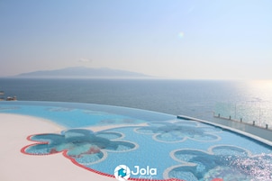 Seasonal outdoor pool, open 9:00 AM to 7:00 PM, pool umbrellas