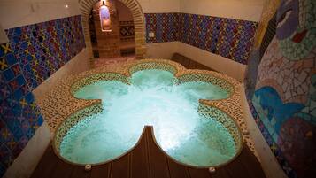 Relax by the serene pool, surrounded by a unique geometric design and a tranquil atmosphere.