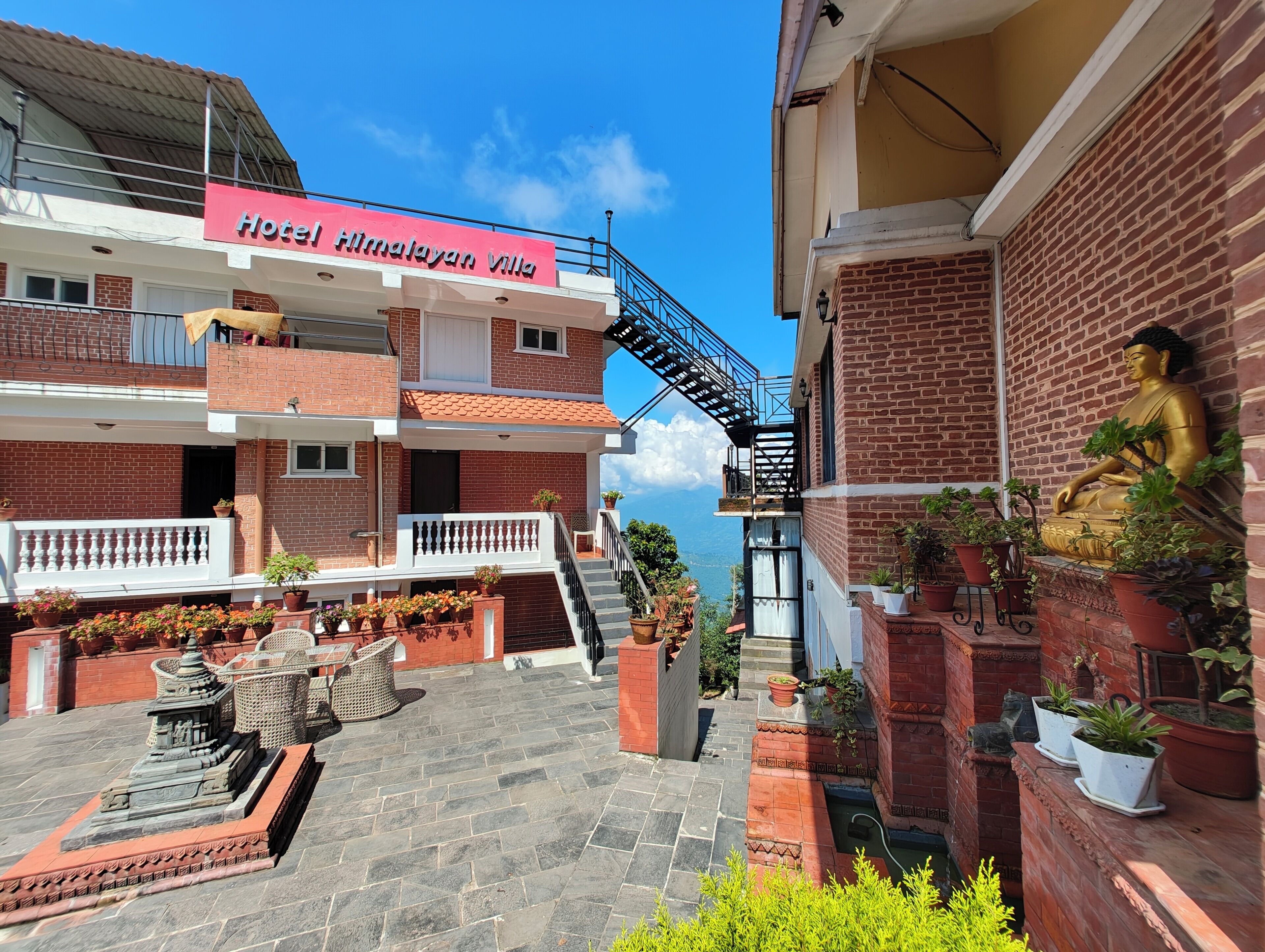 A hotel with a sign reading "Hotel Himalayan Villa".