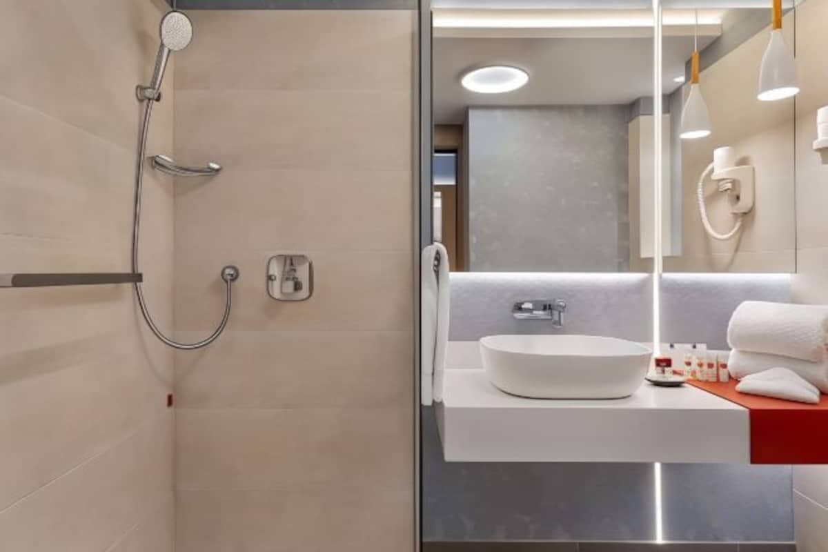 Bathroom | Hair dryer, bathrobes, slippers, towels