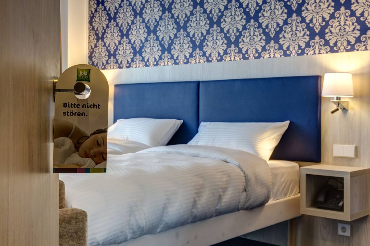 comfort twin room, 2 single beds | in-room safe, desk, soundproofing, iron/ironing board