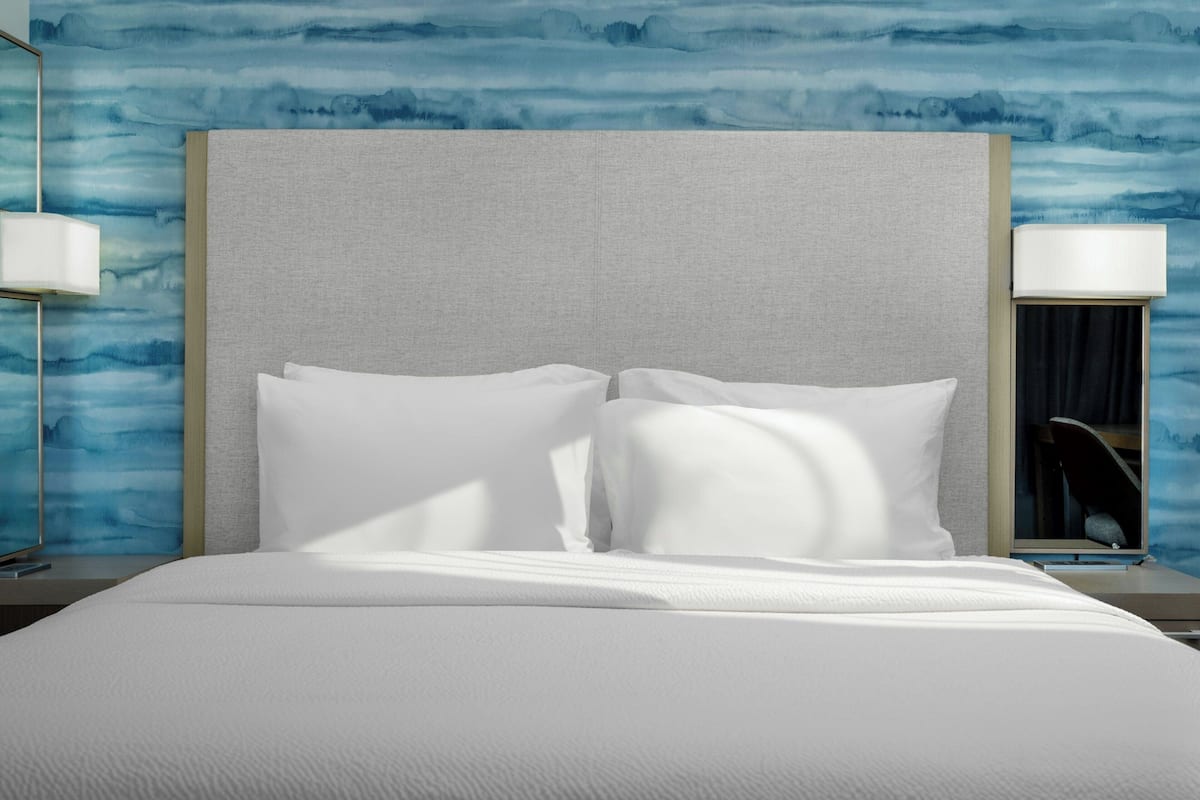 Premium bedding, down comforters, desk, laptop workspace
