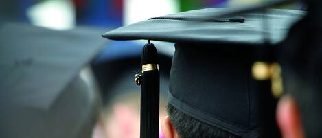 A graduation cap with a tassel, indicating a graduation ceremony.