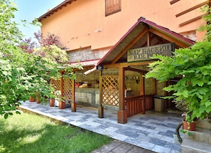 A bar with a wooden structure and a tiled floor.