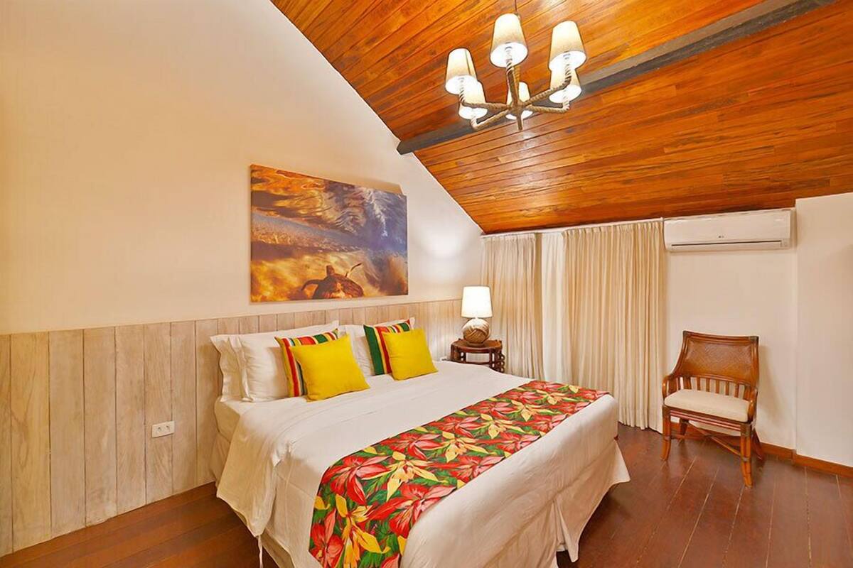 Superior Floor Apartment, Ocean View | Minibar, individually decorated, blackout drapes, iron/ironing board