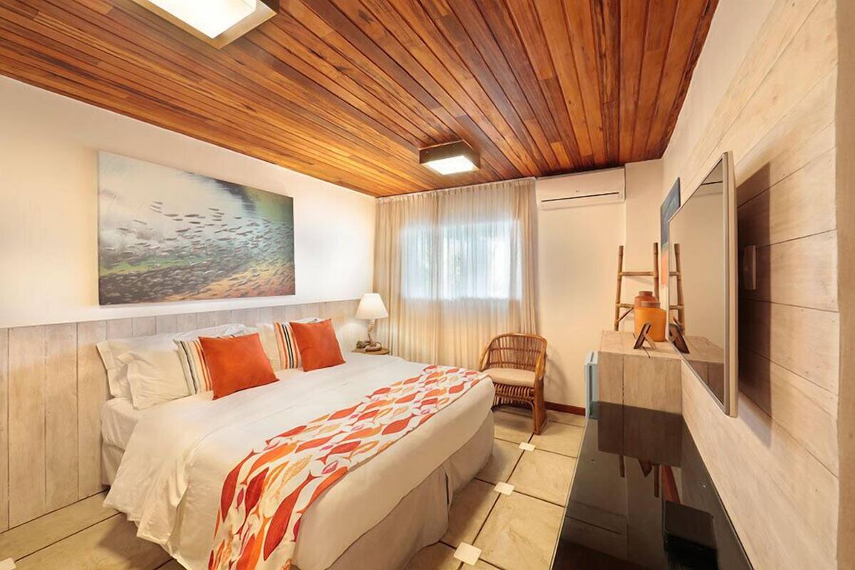 Ground Floor Apartment, Ocean View | Minibar, individually decorated, blackout drapes, iron/ironing board