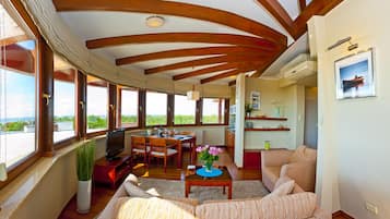 Apartment, Sea View | Living area | Flat-screen TV