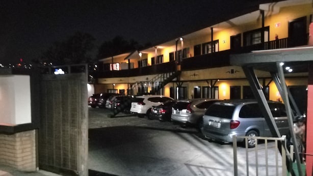 A multi-story parking garage with several cars parked. - Hotel Coronado (Ensenada)