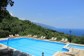 Outdoor pool, pool umbrellas, sun loungers