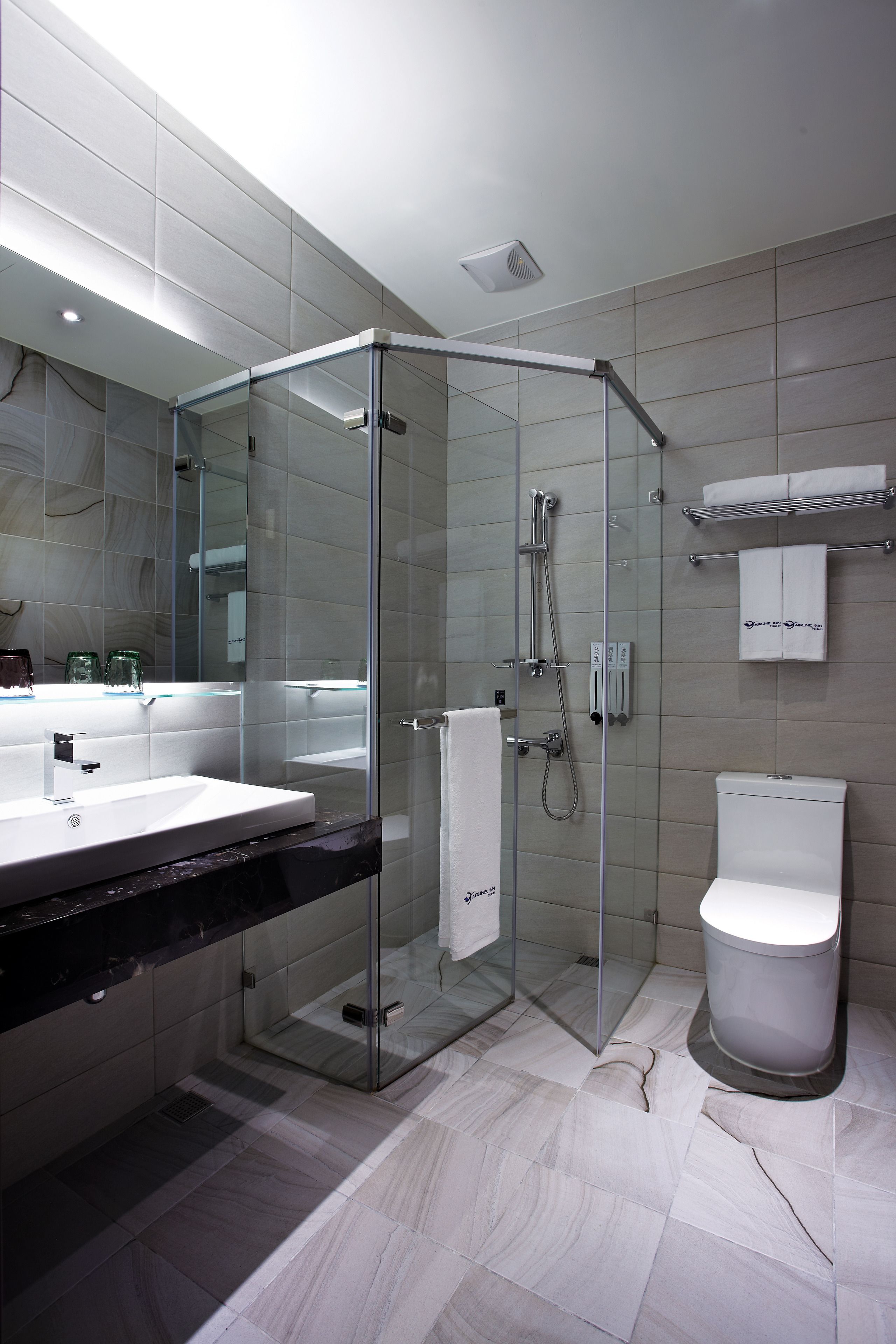 hair dryer, slippers, electronic bidet, towels