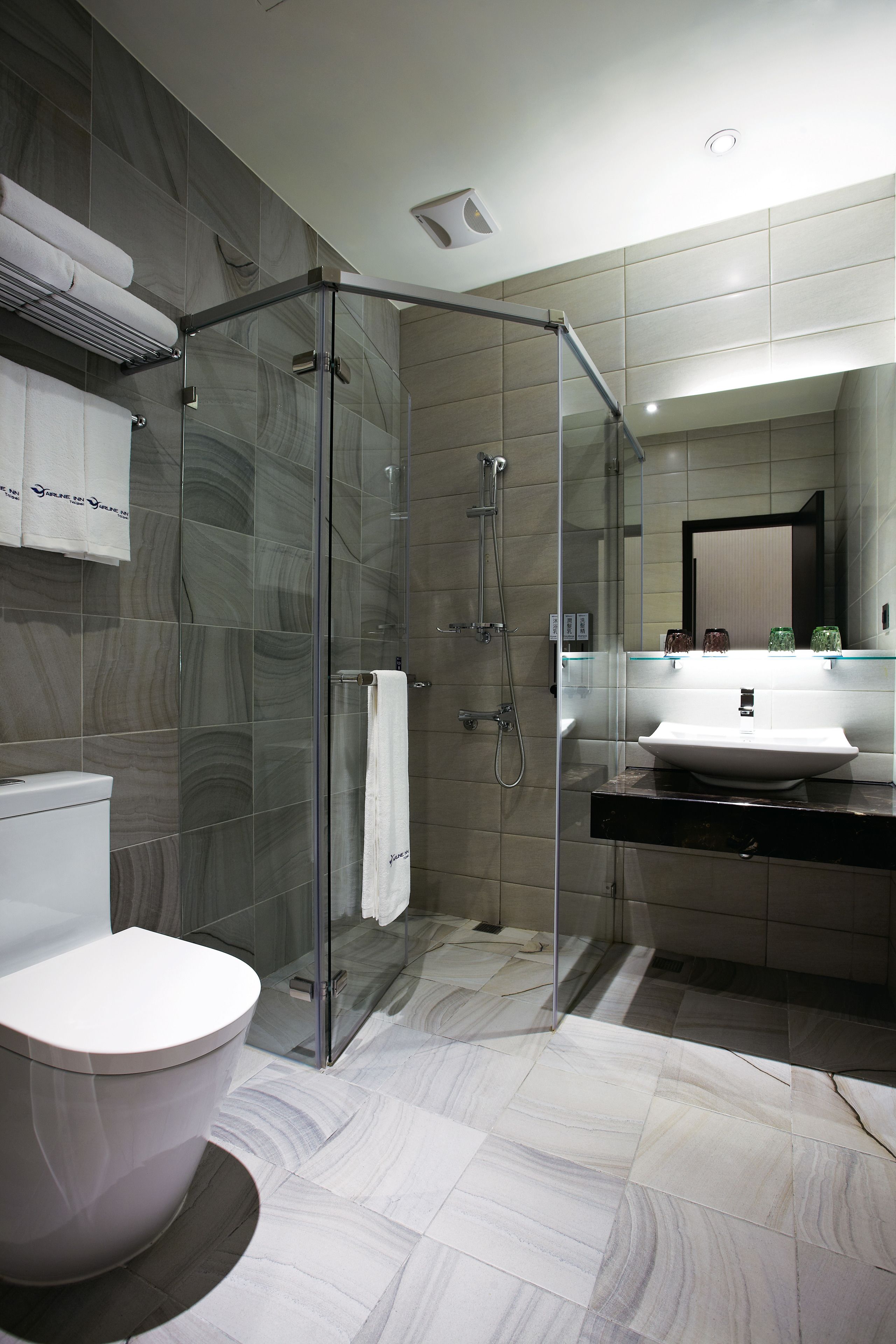 hair dryer, slippers, electronic bidet, towels